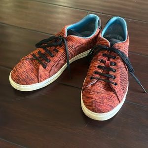 Ted Baker red heather knit shoes with blue geometric liner and black laces.